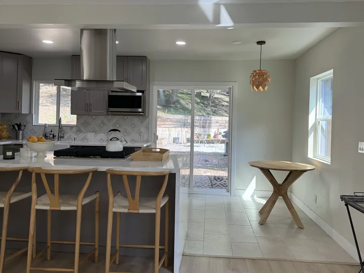 Gray kitchen breakfast bar beside the dining nook in Sunland