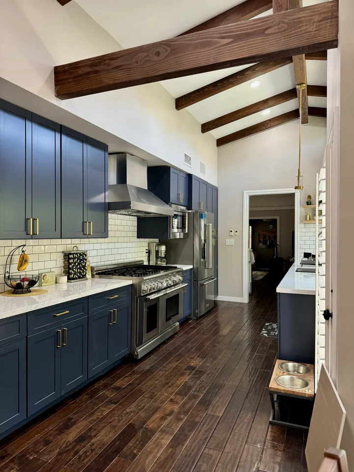 Indigo blue kitchen with exposed wood beams in Pasadena